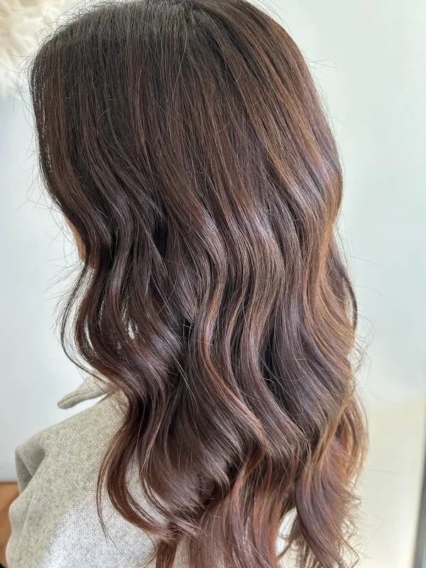 Glossy chocolate-brown waves with soft caramel ribbons, colored by Amy Kurtz